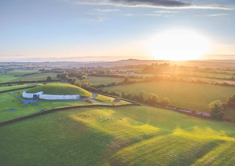 Aerial view across the Boyne Valley countryside with fields, woodland and the river bend