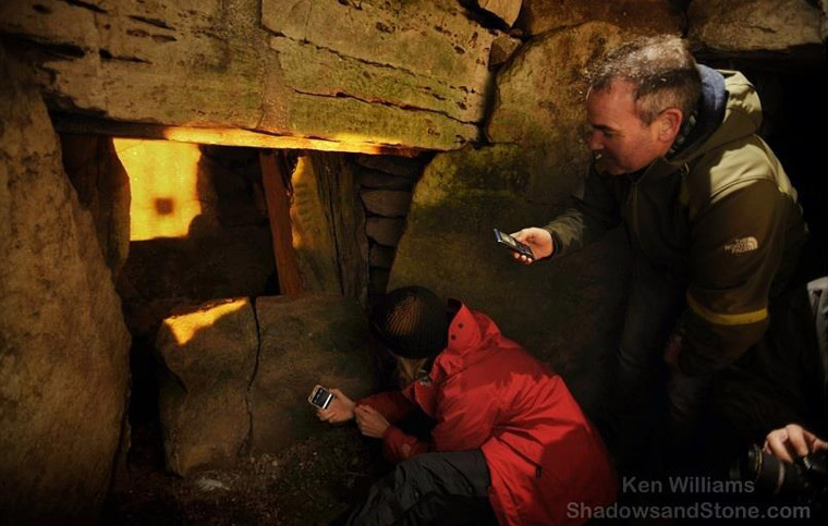 Sunbeam on the backstone of the chamber inside Cairn T 